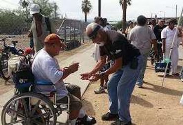 Woman helping a child at a booth.