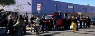 Woman holding a large box of groceries.