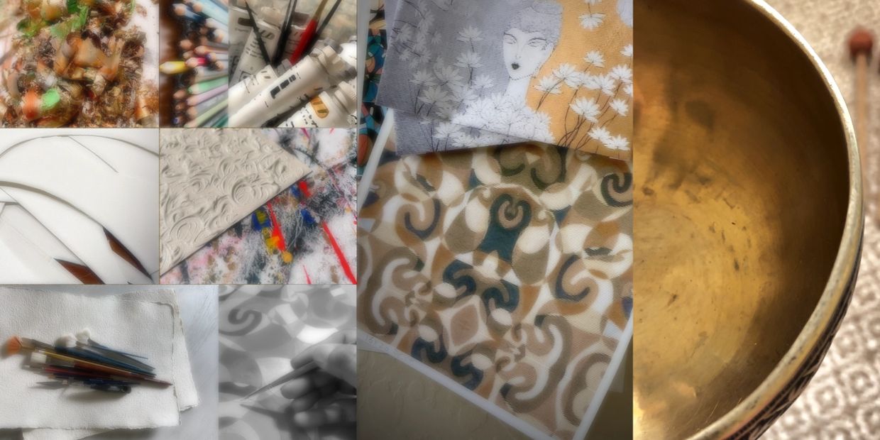 Art supplies, paintings, and a brass bowl in a creative workspace.