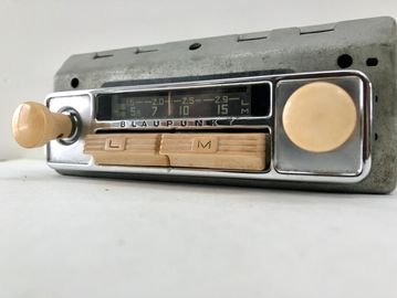 Vintage Blaupunkt car radio with wooden knobs and tuner.