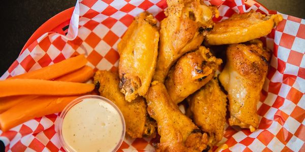 delicious chicken wings with a dip