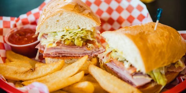 closeup shot of a sandwich and fries