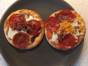 Home made pizza with Pepperoni, Bacon, and Mac n Cheese.