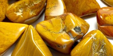 Various polished yellow jasper stones.