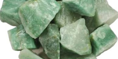 Green rough gemstones piled together.