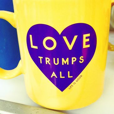 Love trumps all coffee mug.