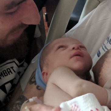 Daddy talks to the baby and he turns his head towards the sound of his voice.