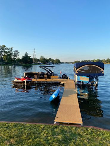 A dock with several boats docked in it.