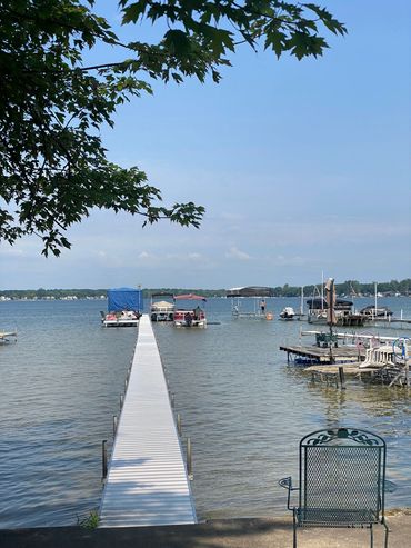 A dock with several boats in the water.