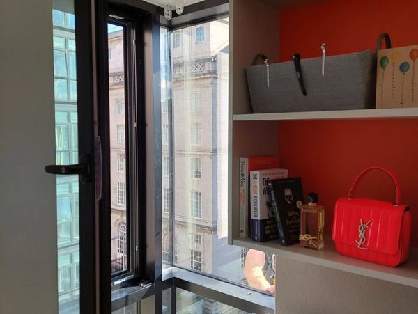 A commercial store with shelves and corner window