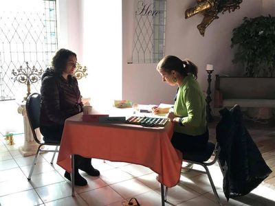 Anna Jalickee and a Woman sitting at a table