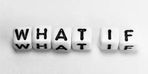 Dice spelling out the phrase 'WHAT IF' on a white background.