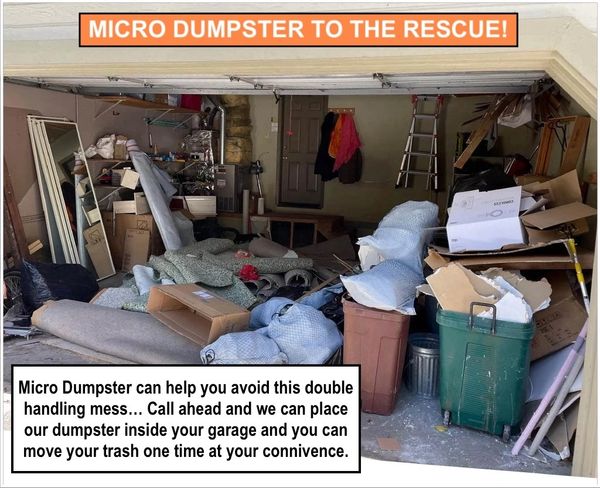 CONSTRUCTION DEMO AND HOUSEHOLD JUNK CLUTTERING A GARAGE FLOOR 