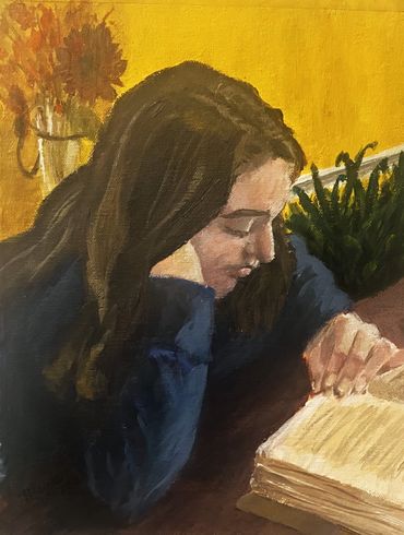 girl reading in a yellow room