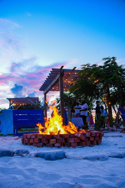 Fire pit and cabana dining areas at Blu Restaurant in Exuma Bahamas