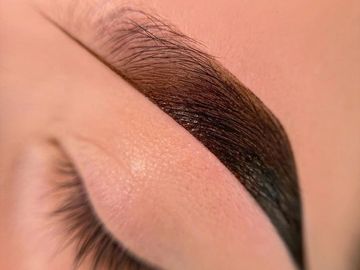 A woman eyebrow after dye and henna