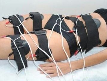 A women's body is covered with electric wires