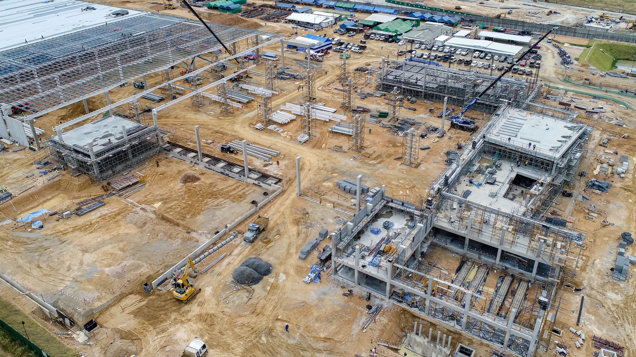 Aerial photo of construction work in progress. Steel and concrete used to construct several building