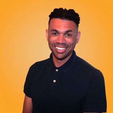 Smiling man in a black polo shirt against an orange background.