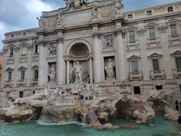 The iconic Trevi Fountain with intricate statues and flowing water.