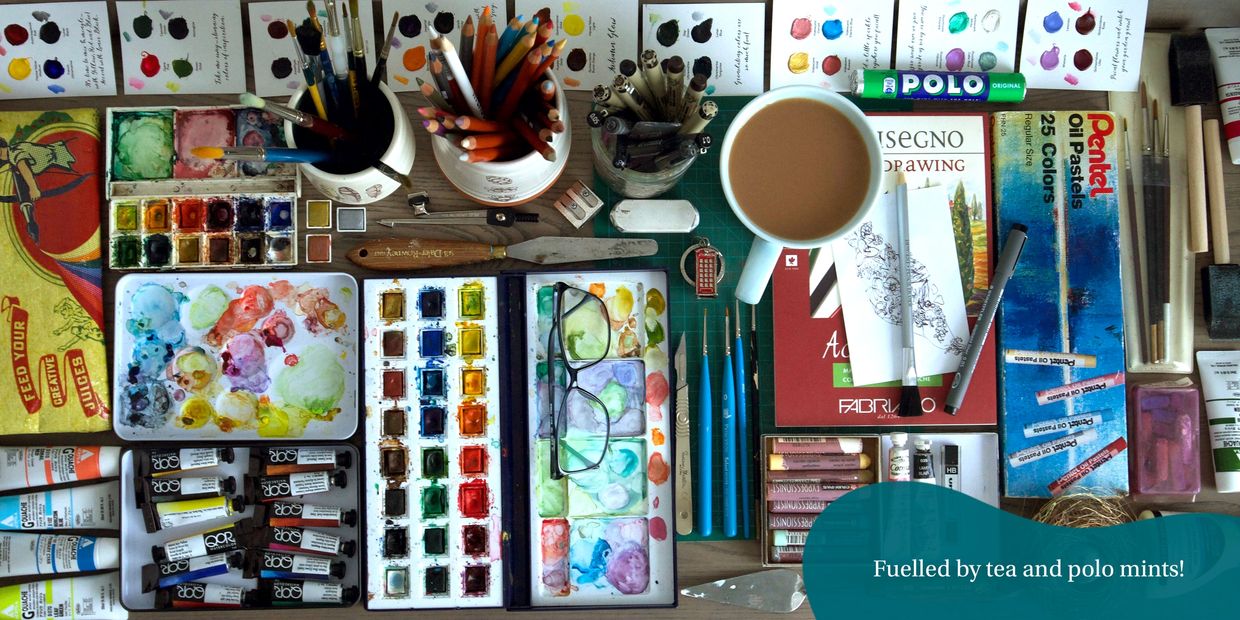 Collection of art supplies, paints, brushes, watercolours, drawing pens, oil pastel, tea and pencils