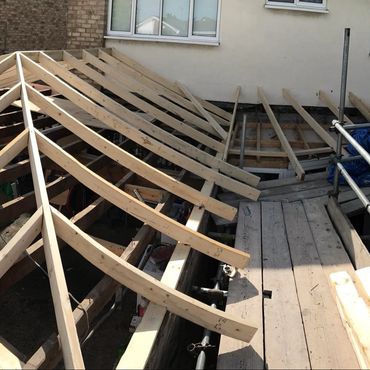 A hipped roof constructed on a garage extension.