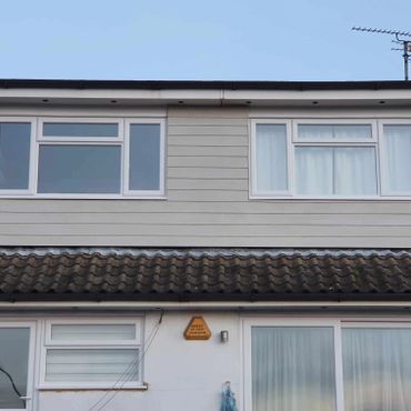 A rear flat roof dormer from a loft conversion, cladded externally with Hardie Plank cladding.
