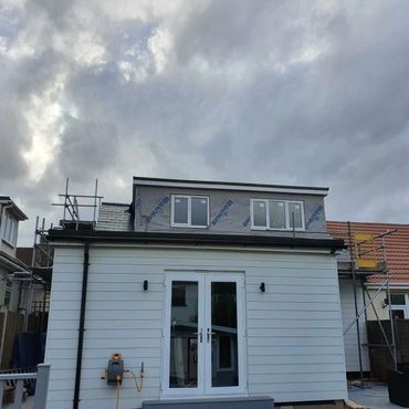 The construction of a rear flat roof dormer, showing the loft conversion.
