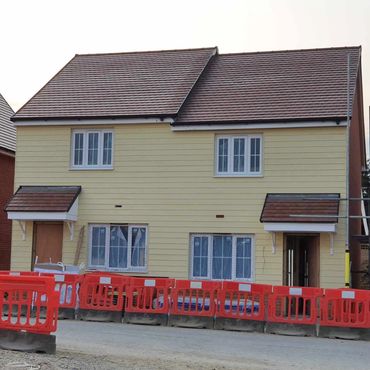 External Hardie Plank cladding, fitted to the entire exterior of two semi-detached new build houses.
