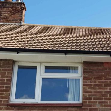 Newly fitted UPVC fascia, soffits, guttering and downpipe.