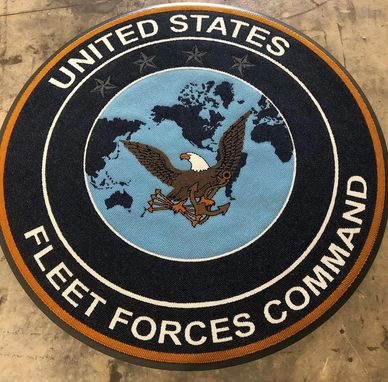 United States Fleet Forces Command emblem with eagle and world map.