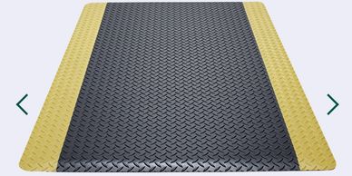 A metal diamond plate with yellow borders on both sides.