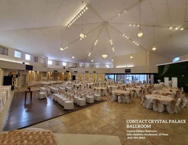 Spacious ballroom with elegant table and chair arrangements, ready for an event.