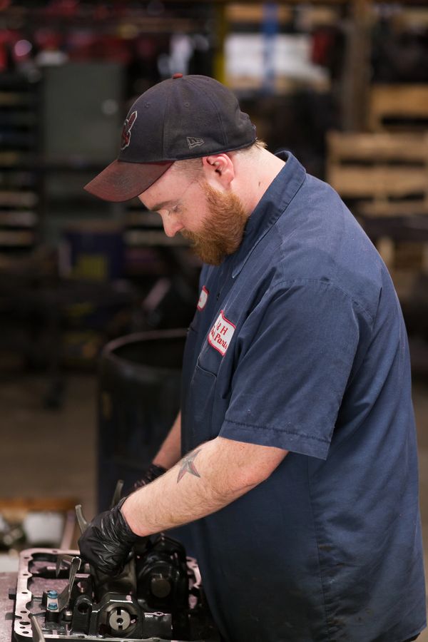 H&H Truck Parts employee working diligently on a repair