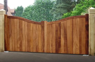 Inverted swan neck iroko hardwood gates Wirral