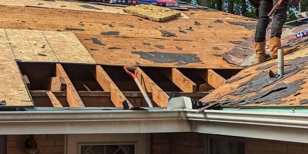 Roof being repaired by roofing company in Leawood, KS near Kansas City, MO