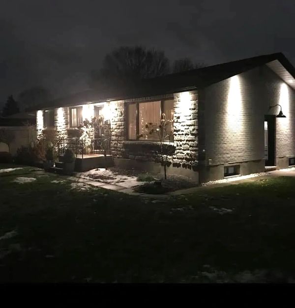 Soffit pot light install single story house.