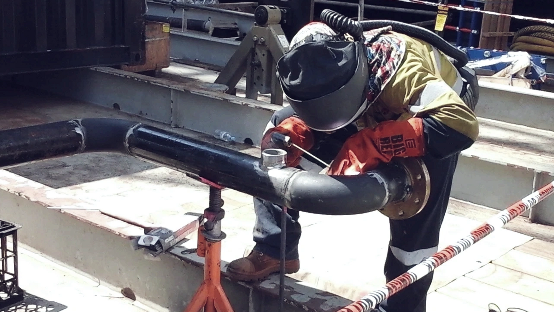 Onsite pipe welding for industrial installation – precision work with full safety and PPE compliance