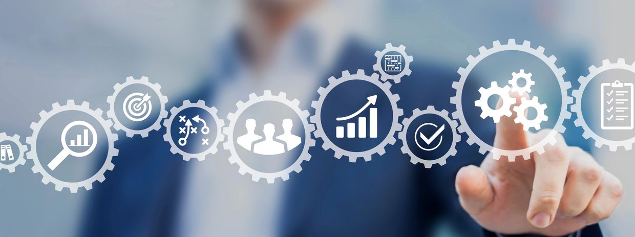 Businessman interacting with virtual gear icons representing business concepts. Client onboarding.
