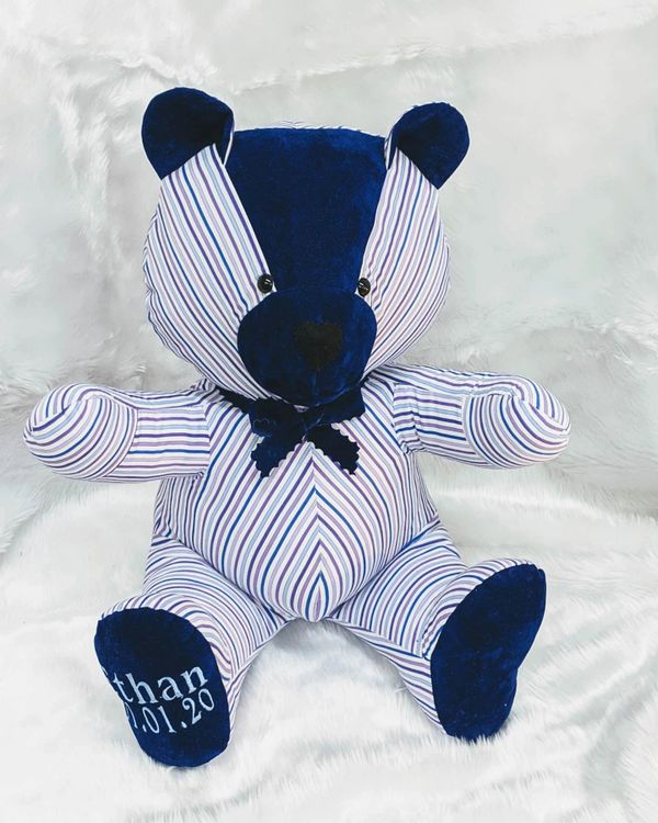 A large memory bear with a personalised paw handmade from a stripy shirt