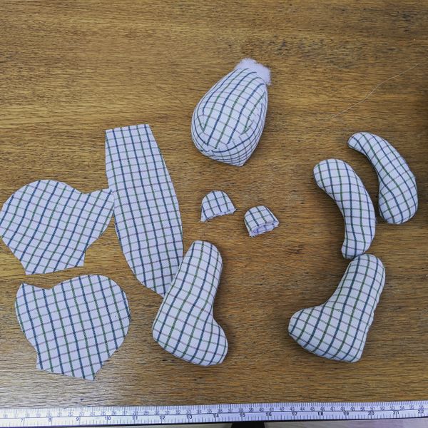 A blue checked memory bear cut out from a shirt & ready to sew together