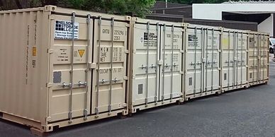 Tan seabox shipping containers as storage units in a storage lot