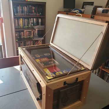 Open wooden retirement chest during construction.