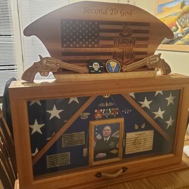 Open retirement chest displaying service memorabilia.