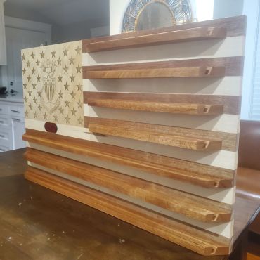 Wooden display frames stacked in the workshop.