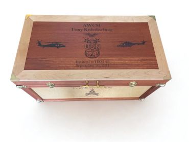 Navy aviation retirement chest with engraved helicopters, service insignia, and brass hardware.