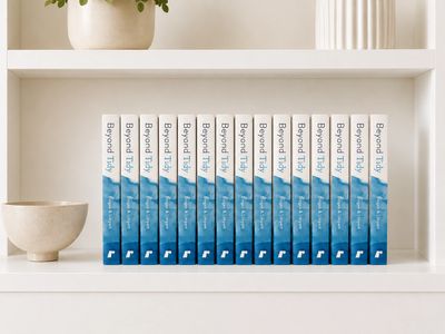 Multiple copies of Beyond Tidy by Brogan and Limpert displayed spine-out on a white bookshelf, style