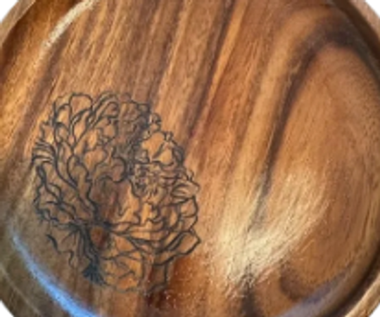 A laser carving on the wooden plate