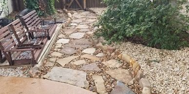 flagstone; mortar; flower bed; stone; rock; stained concrete; walkway; patio