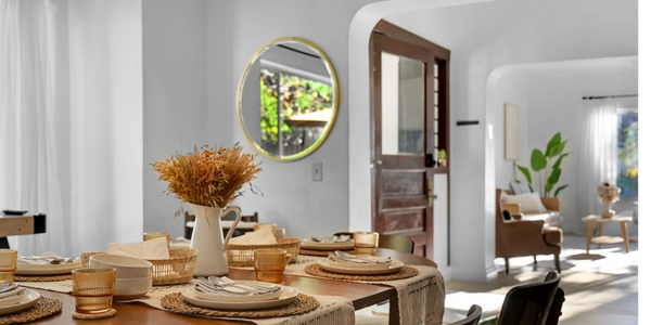 Warm dining table setup with rustic decor and natural light.